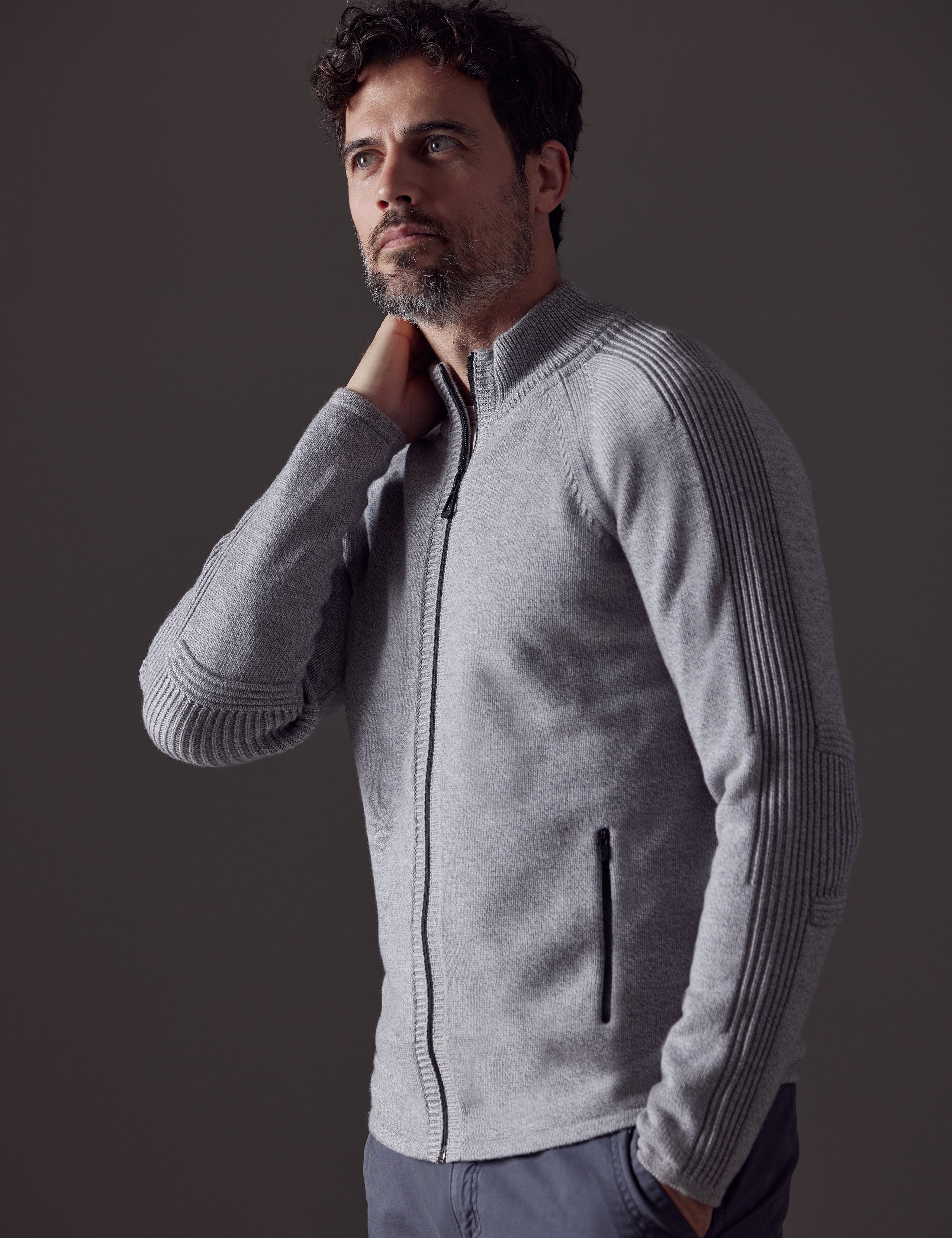 Man wearing grey Riley Full-Zip Sweater from AETHER Apparel