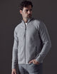 Man wearing grey Riley Full-Zip Sweater from AETHER Apparel