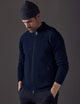 Man wearing dark blue Riley Full-Zip Sweater