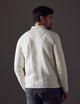 Man wearing white Riley Full-Zip Sweater from AETHER Apparel