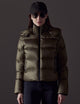 Woman wearing green puffer jacket from AETHER Apparel