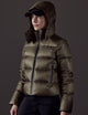 Woman wearing green puffer jacket from AETHER Apparel