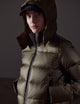 Woman wearing green puffer jacket from AETHER Apparel