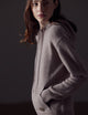 Woman wearing light brown Ava Cashmere Hooded Sweater