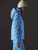 woman wearing blue snow jacket from AETHER Apparel
