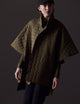 Woman wearing green Bardo Poncho Jacket from AETHER Apparel