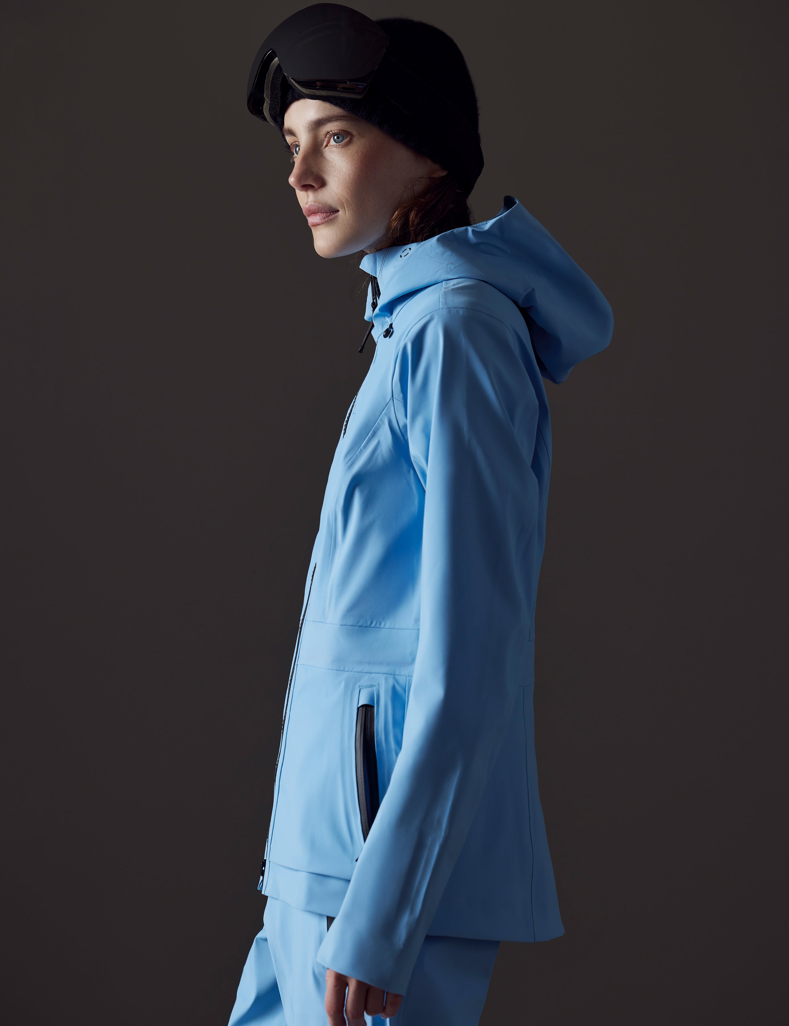 woman wearing blue snow jacket from AETHER Apparel