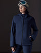 woman wearing dark blue snow jacket from AETHER Apparel