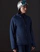 woman wearing dark blue snow jacket from AETHER Apparel