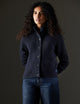 Woman wearing dark blue sweater from AETHER Apparel