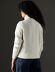 Woman wearing white sweater from AETHER Apparel