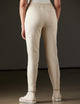 Woman wearing beige pants from AETHER Apparel