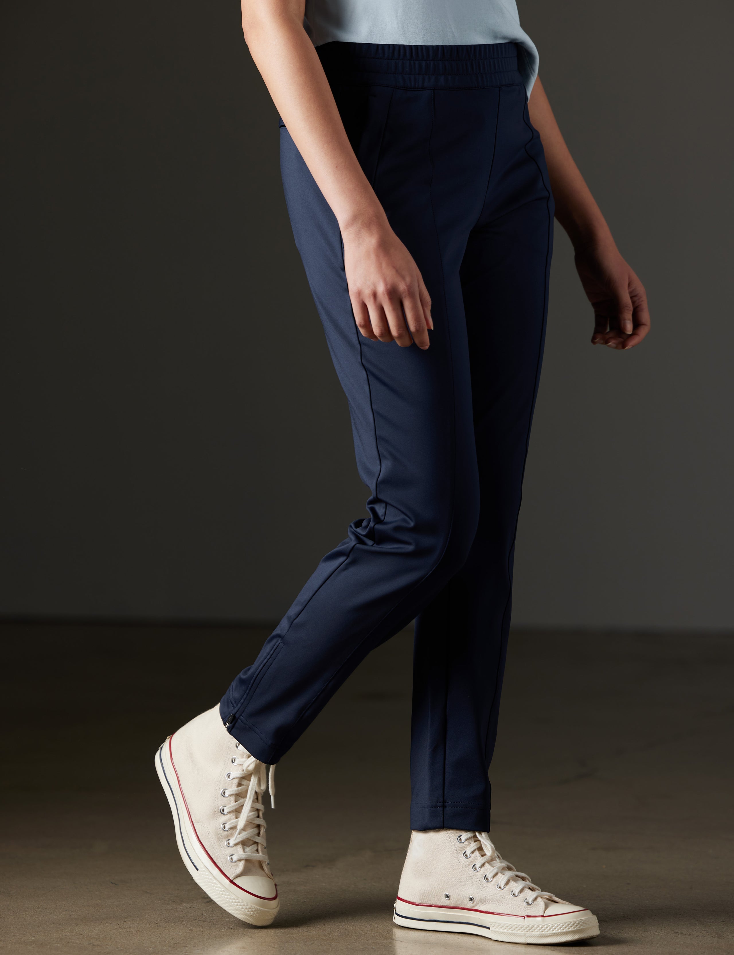 Woman wearing blue pants from AETHER Apparel