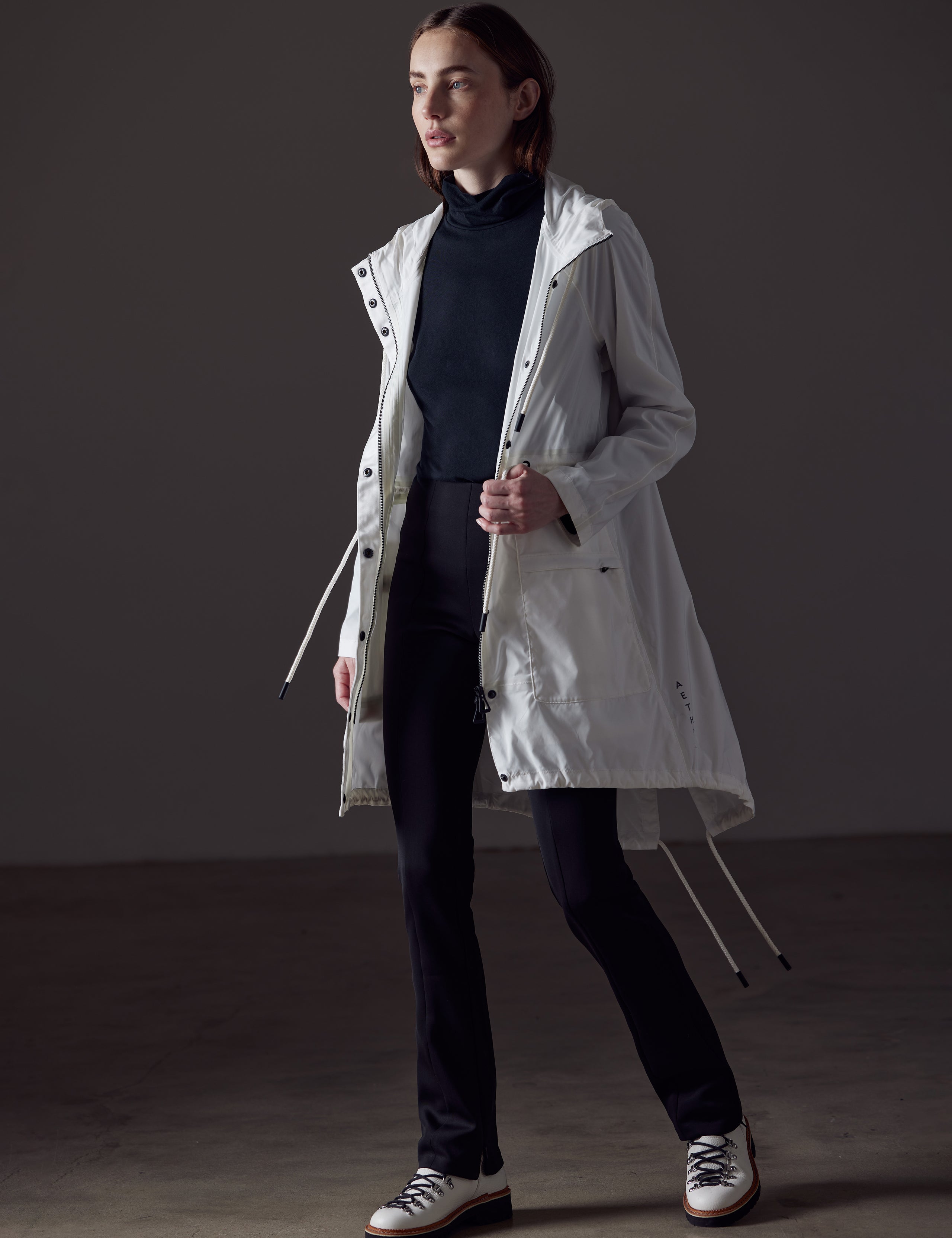 woman wearing white jacket from AETHER Apparel