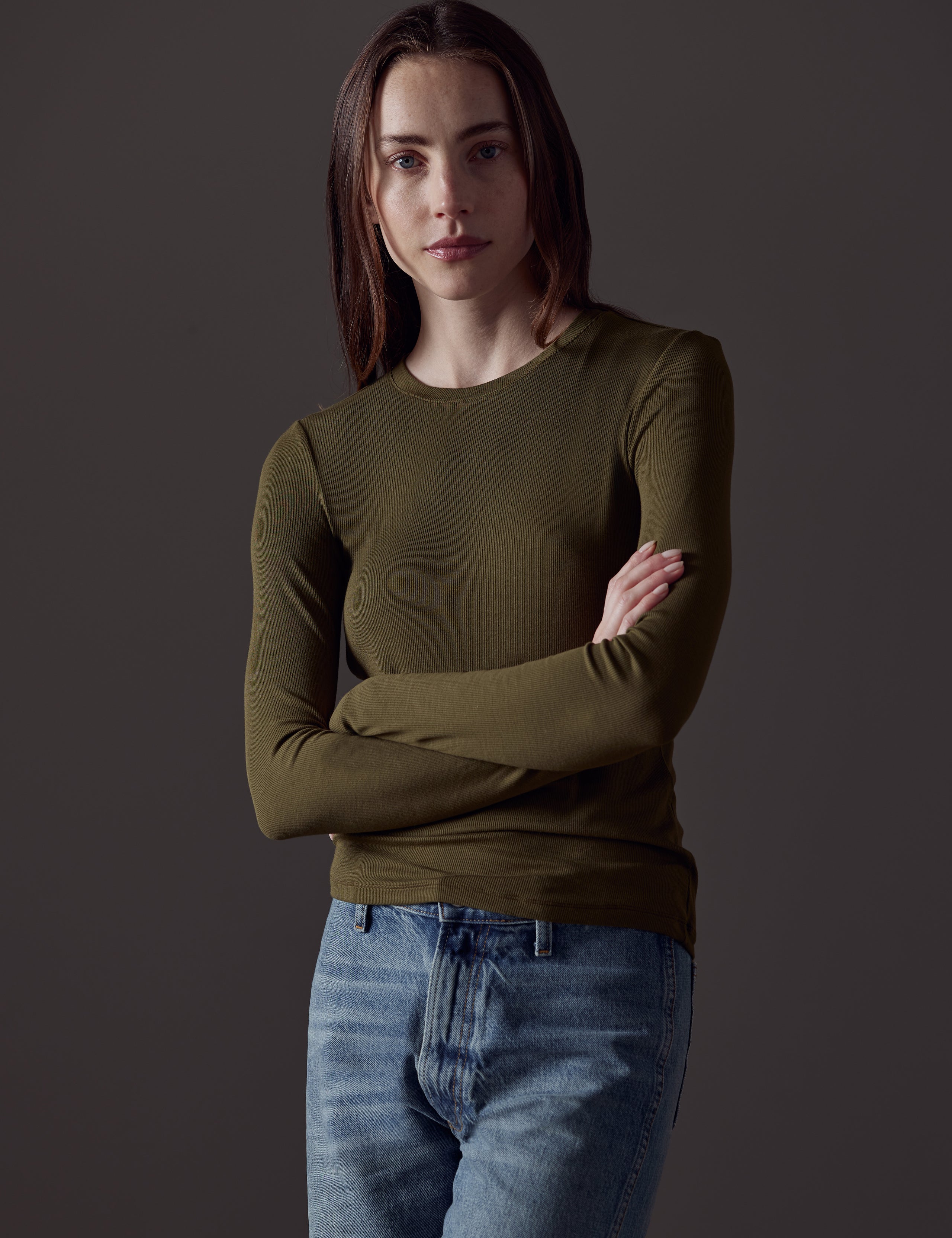 woman wearing green long-sleeve shirt from AETHER Apparel