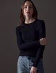 woman wearing black long-sleeve shirt from AETHER Apparel