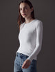 woman wearing white long-sleeve shirt from AETHER Apparel