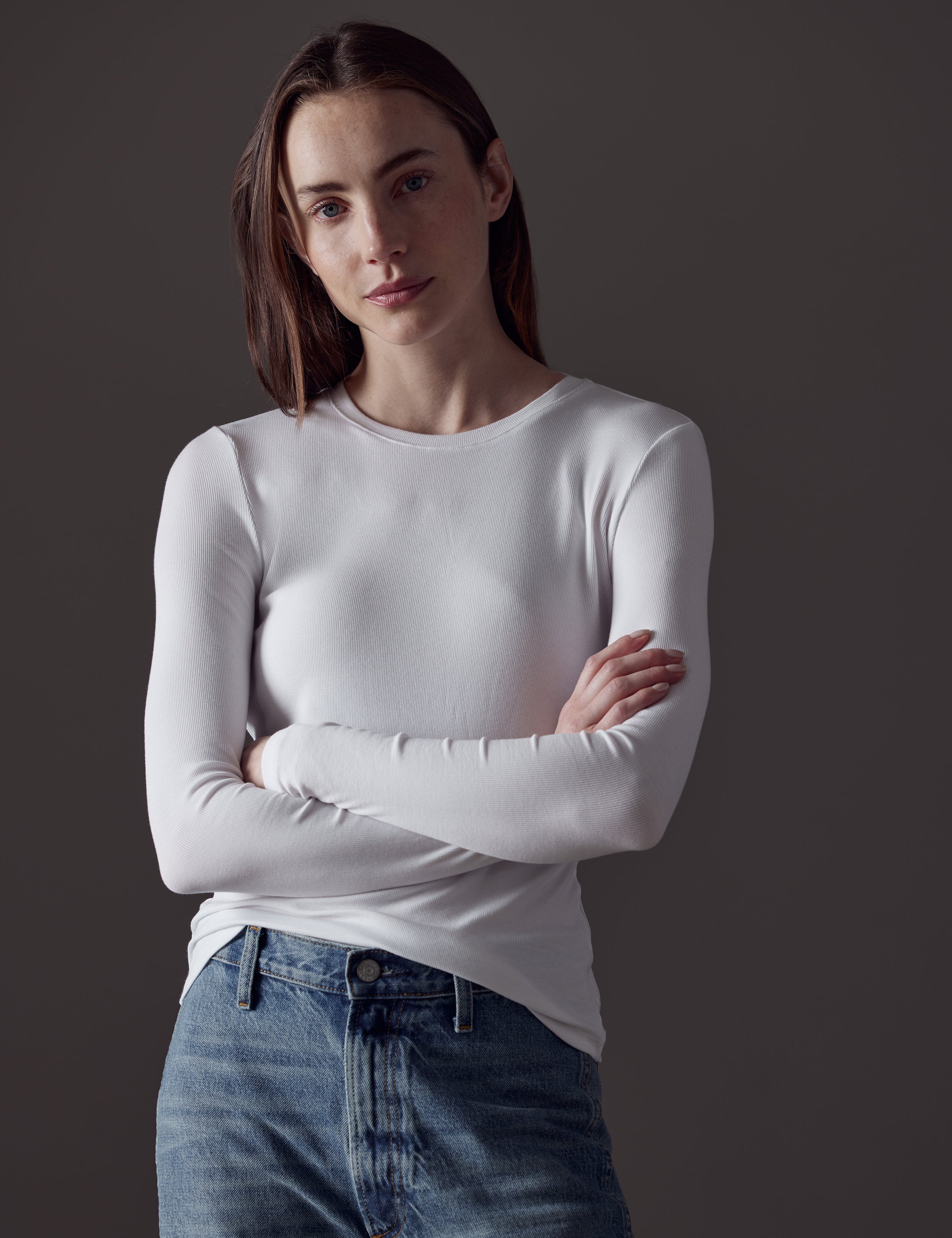 woman wearing white long-sleeve shirt from AETHER Apparel