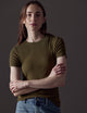 woman wearing green short-sleeve shirt from AETHER Apparel