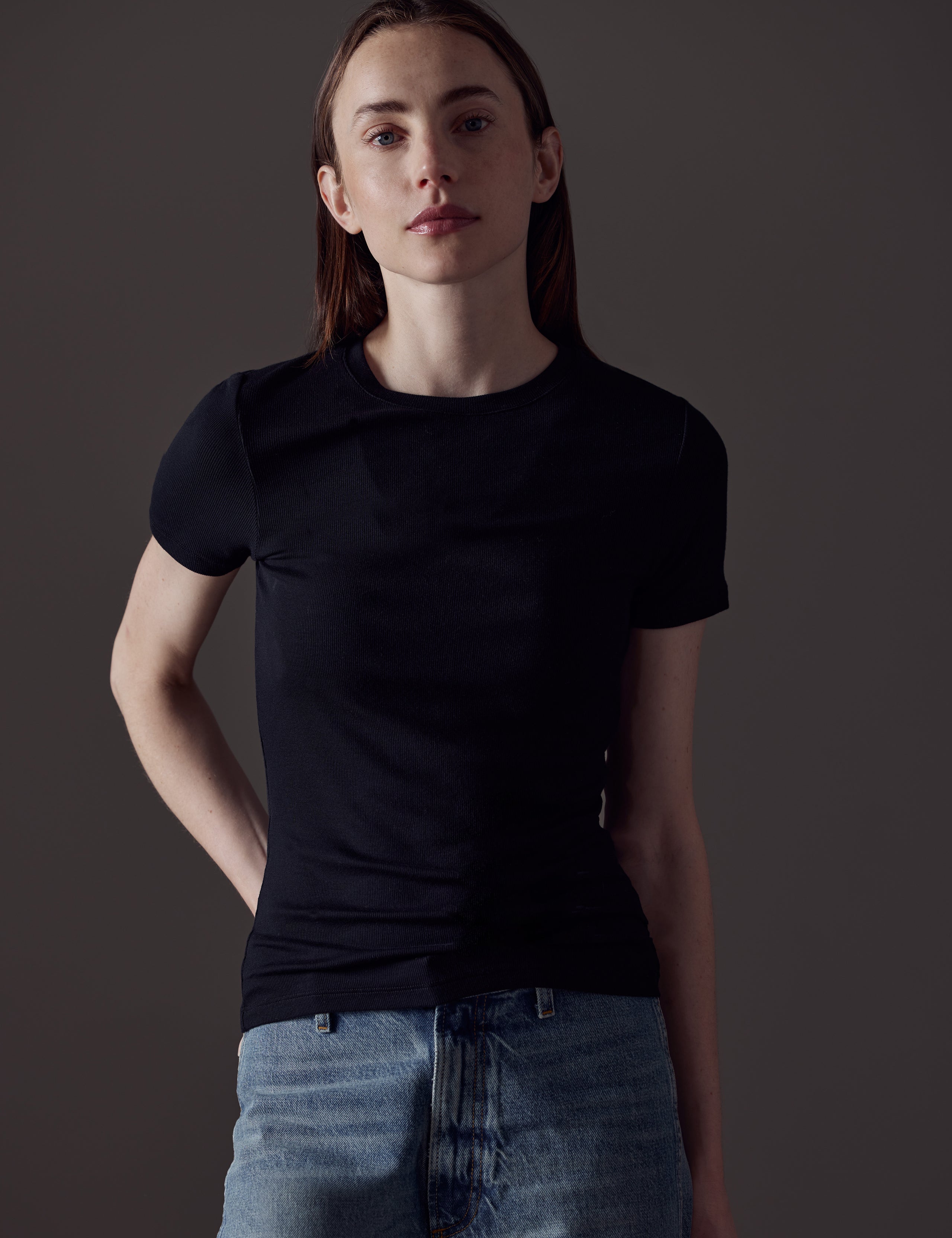 woman wearing black short-sleeve shirt from AETHER Apparel