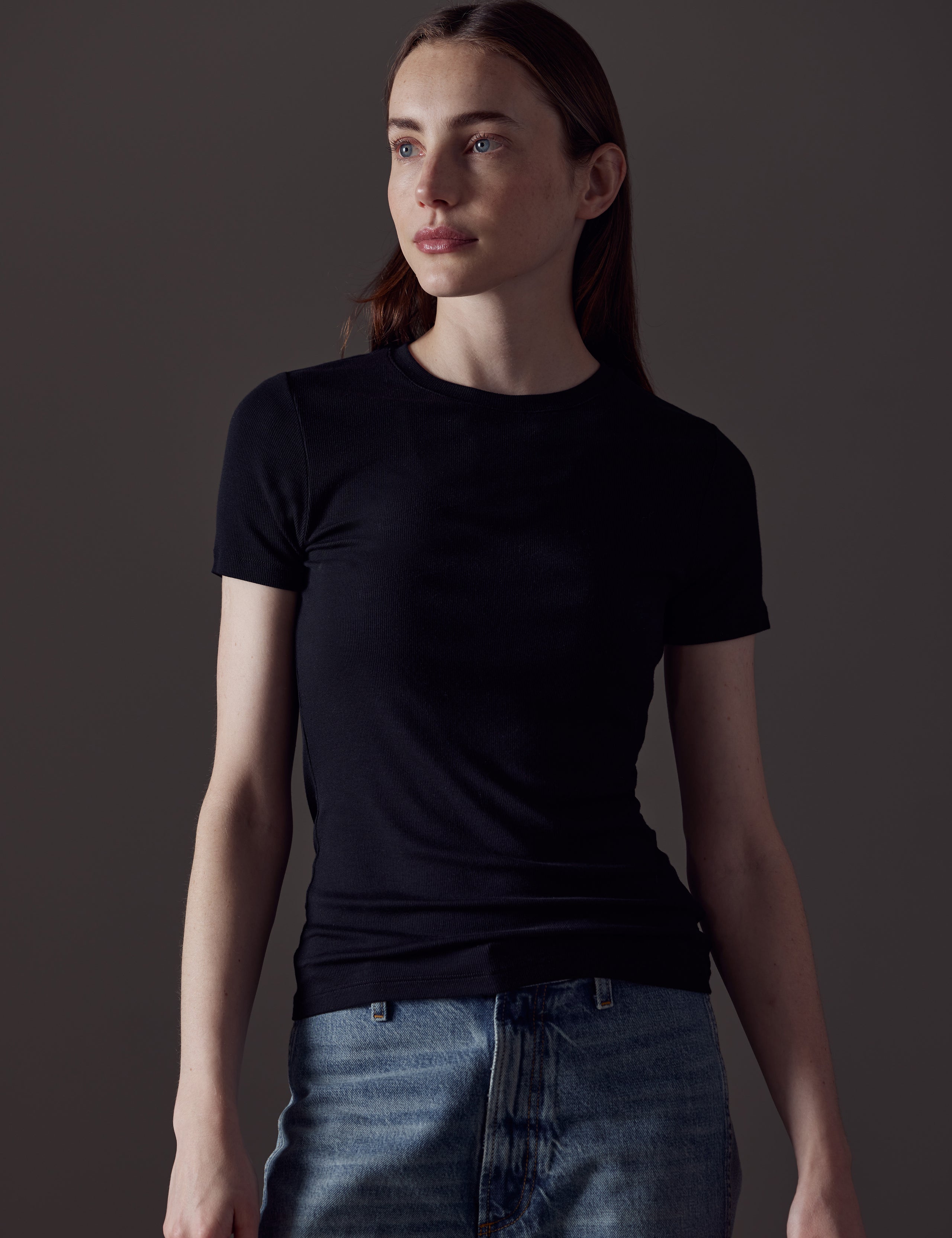 woman wearing black short-sleeve shirt from AETHER Apparel