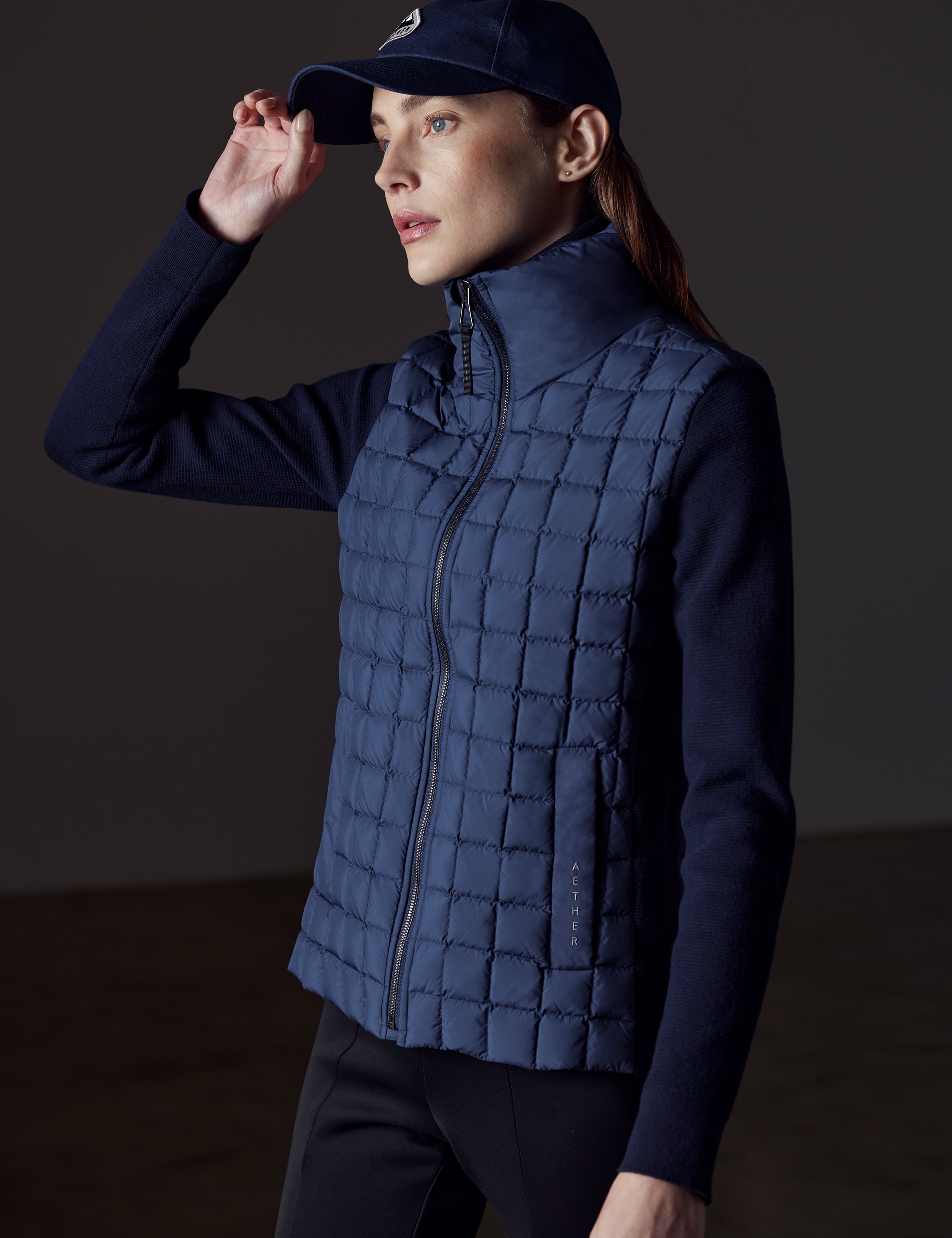 woman wearing blue insulated jacket from AETHER Apparel