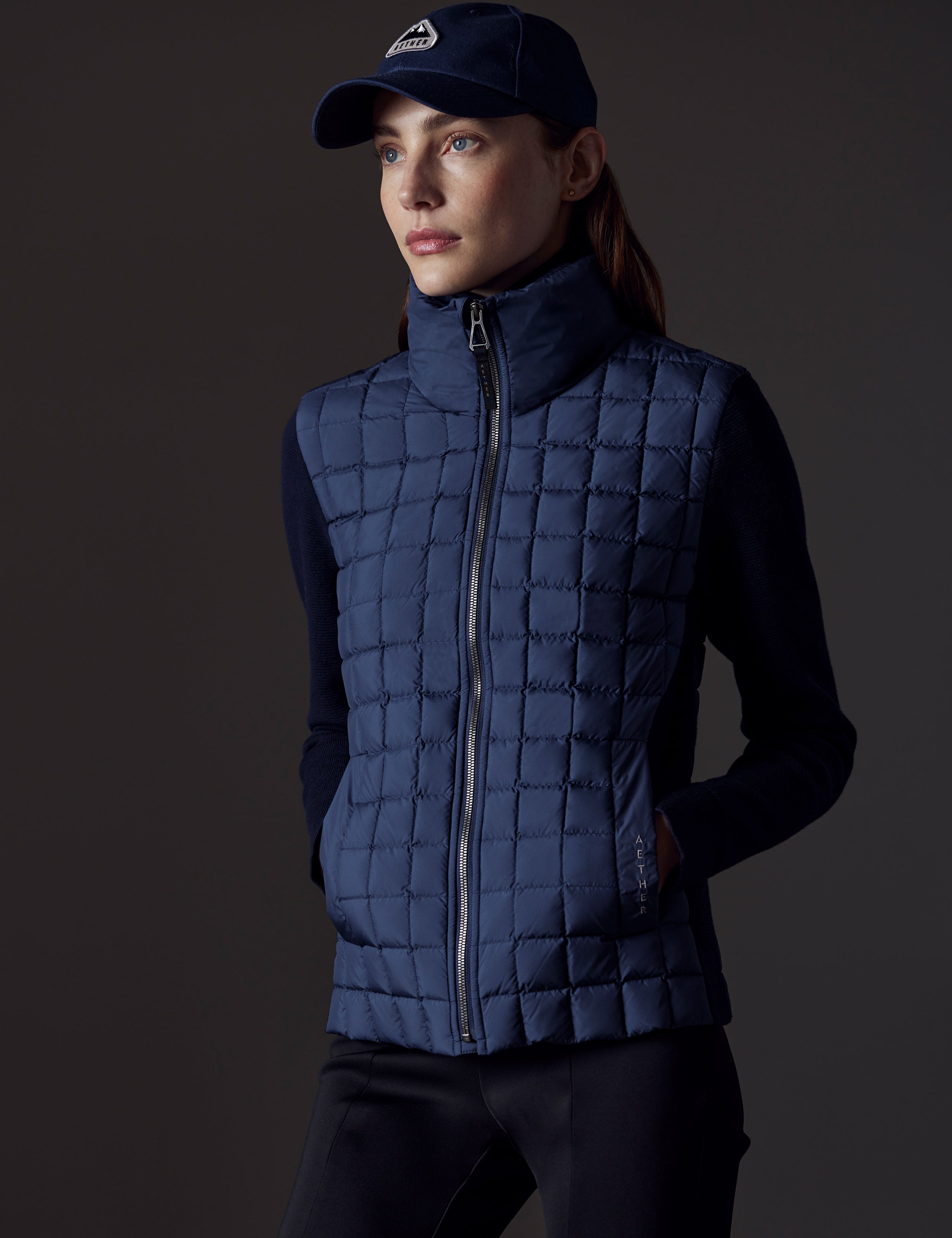 woman wearing blue insulated jacket from AETHER Apparel