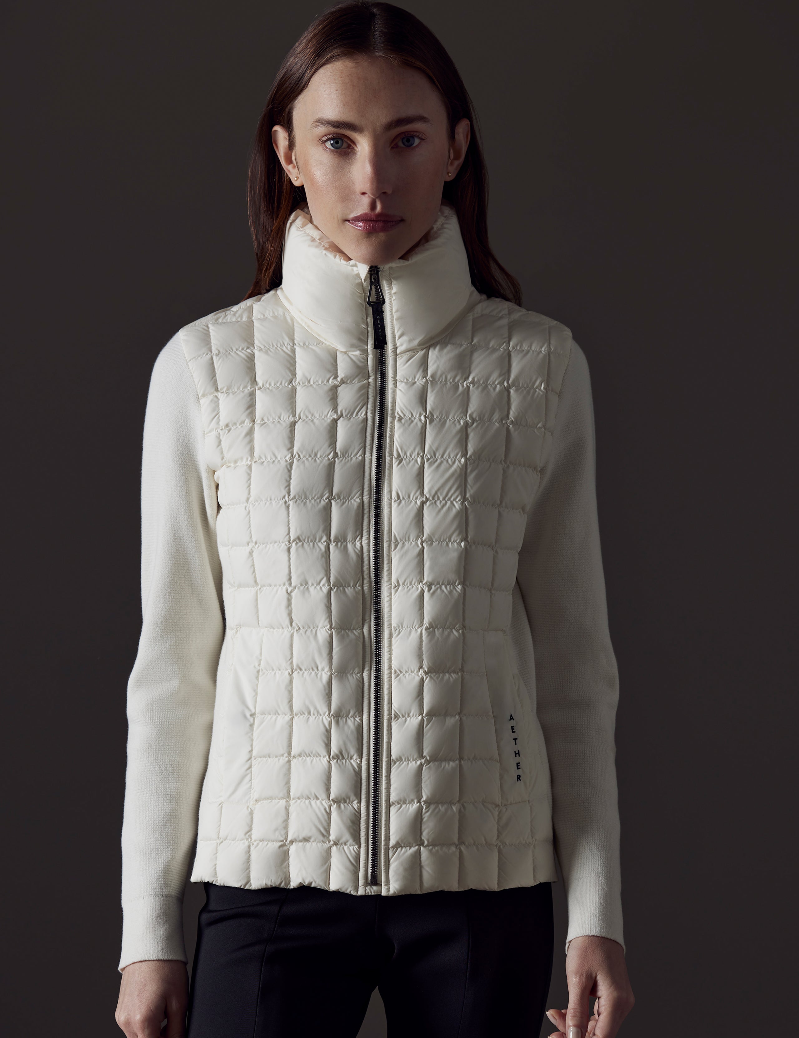 woman wearing white insulated jacket from AETHER Apparel