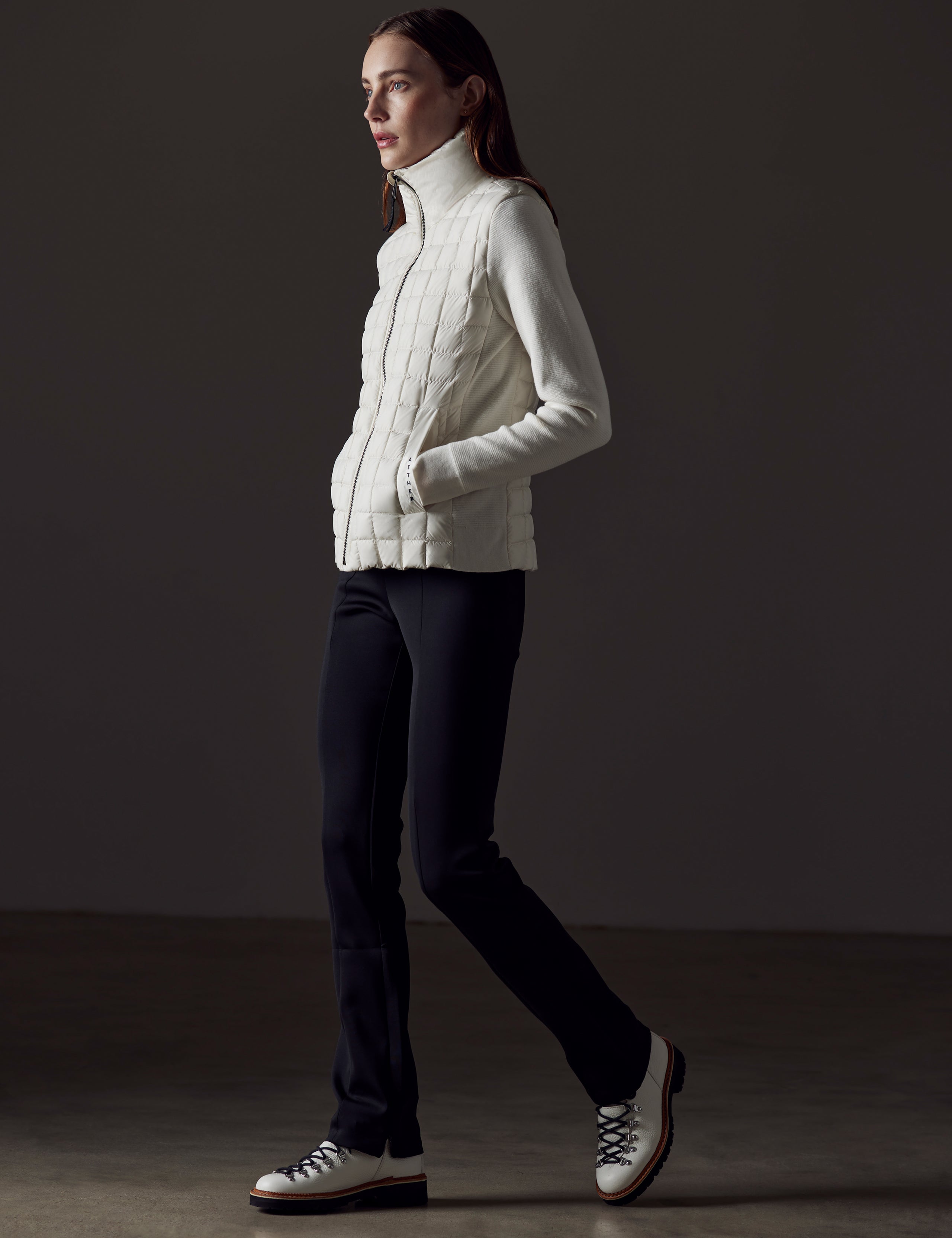 woman wearing white insulated jacket from AETHER Apparel