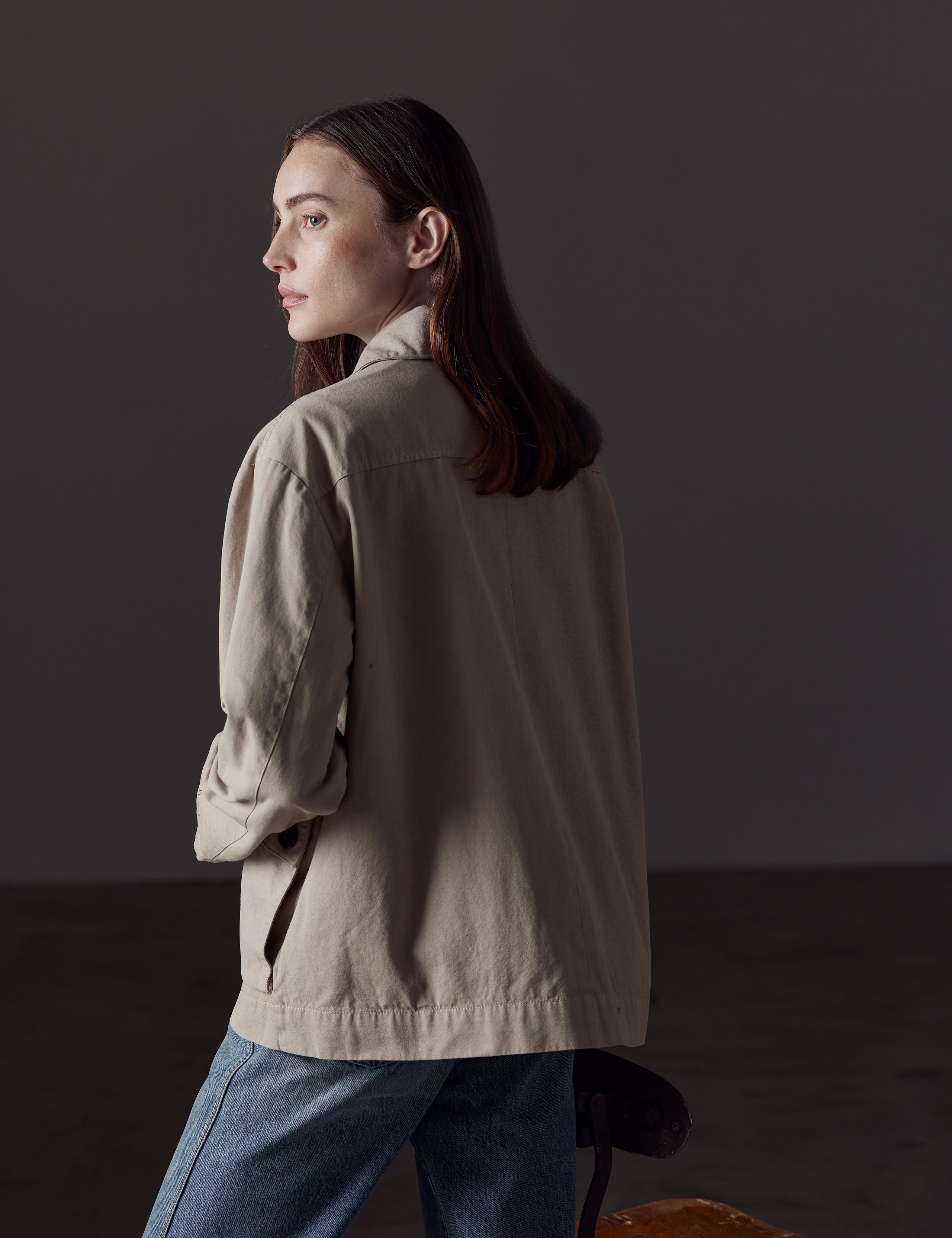 Woman wearing light brown button-up jacket from AETHER Apparel 