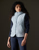 Woman wearing blue fleece vest from AETHER Apparel