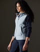 Woman wearing blue fleece vest from AETHER Apparel