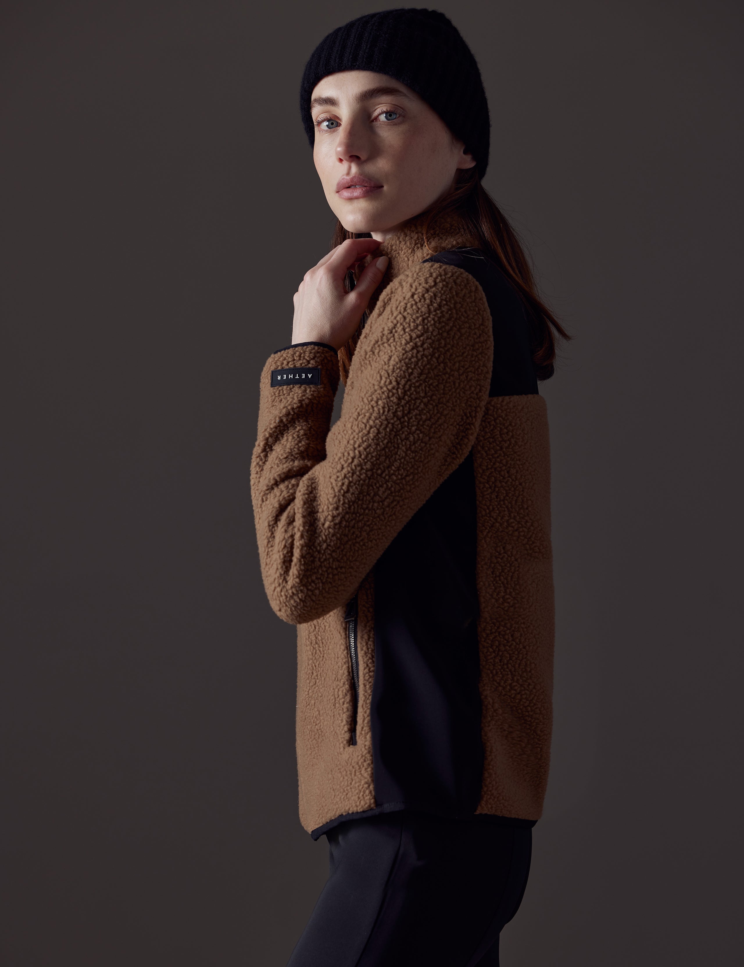 Woman wearing brown fleece from AETHER Apparel