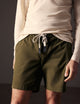 man wearing green cotton ripstop shorts from AETHER Apparel