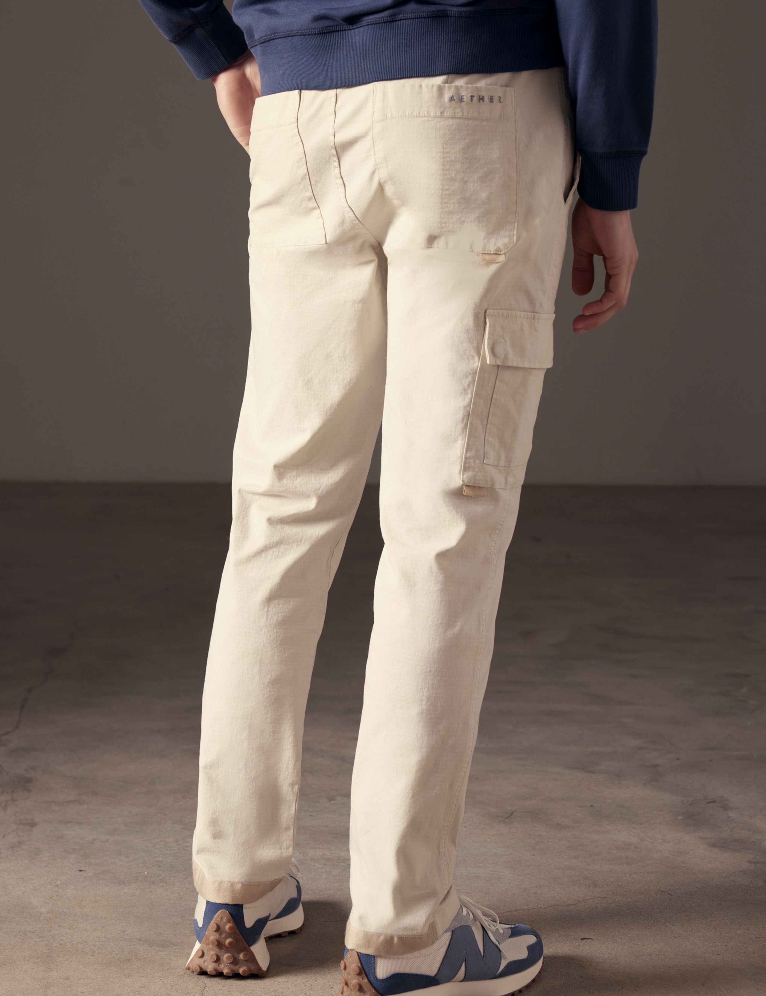 back view of man wearing beige cotton ripstop pants