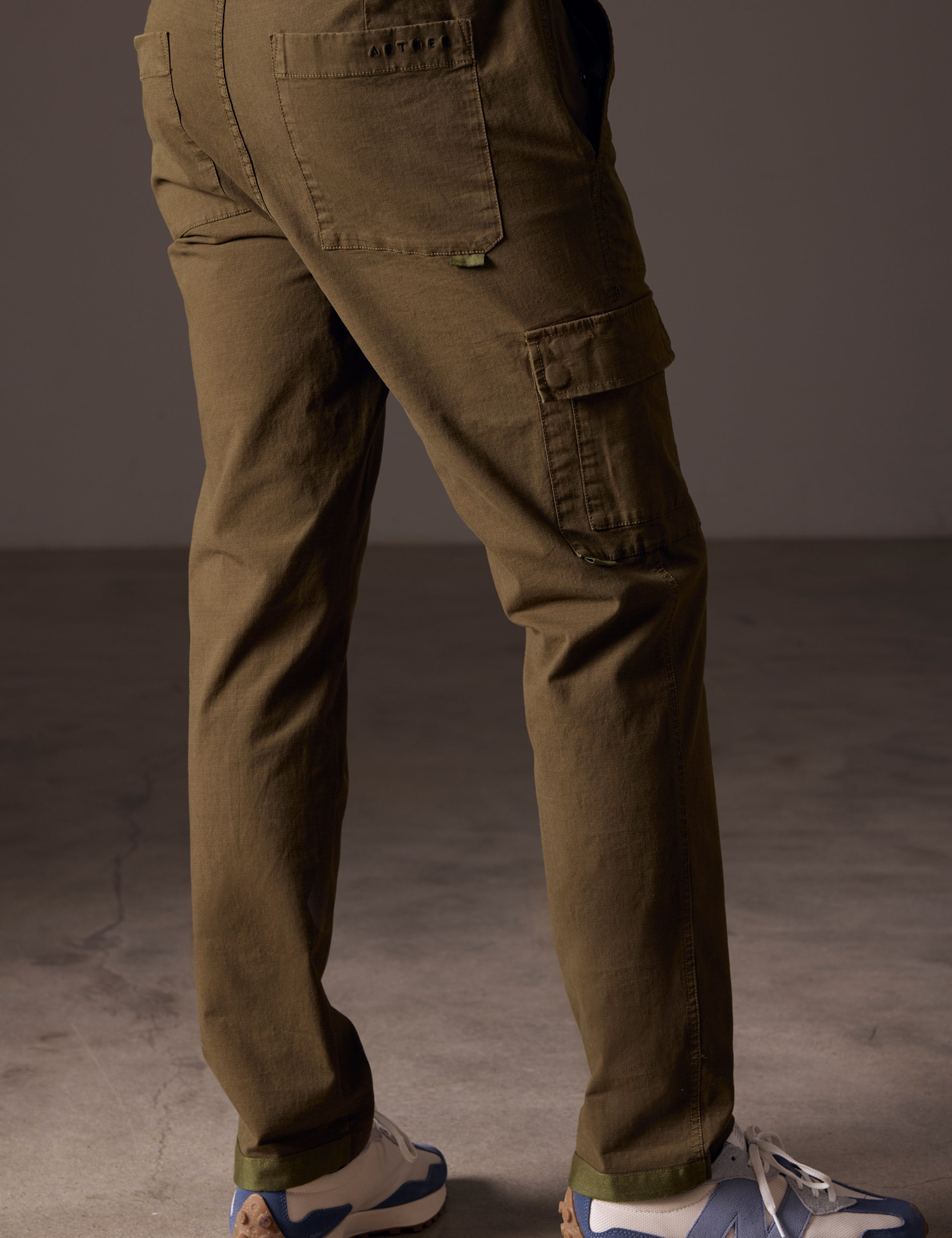 back view of man wearing green cotton ripstop pants