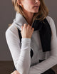 woman wearing cashmere scarf with grey front and black back