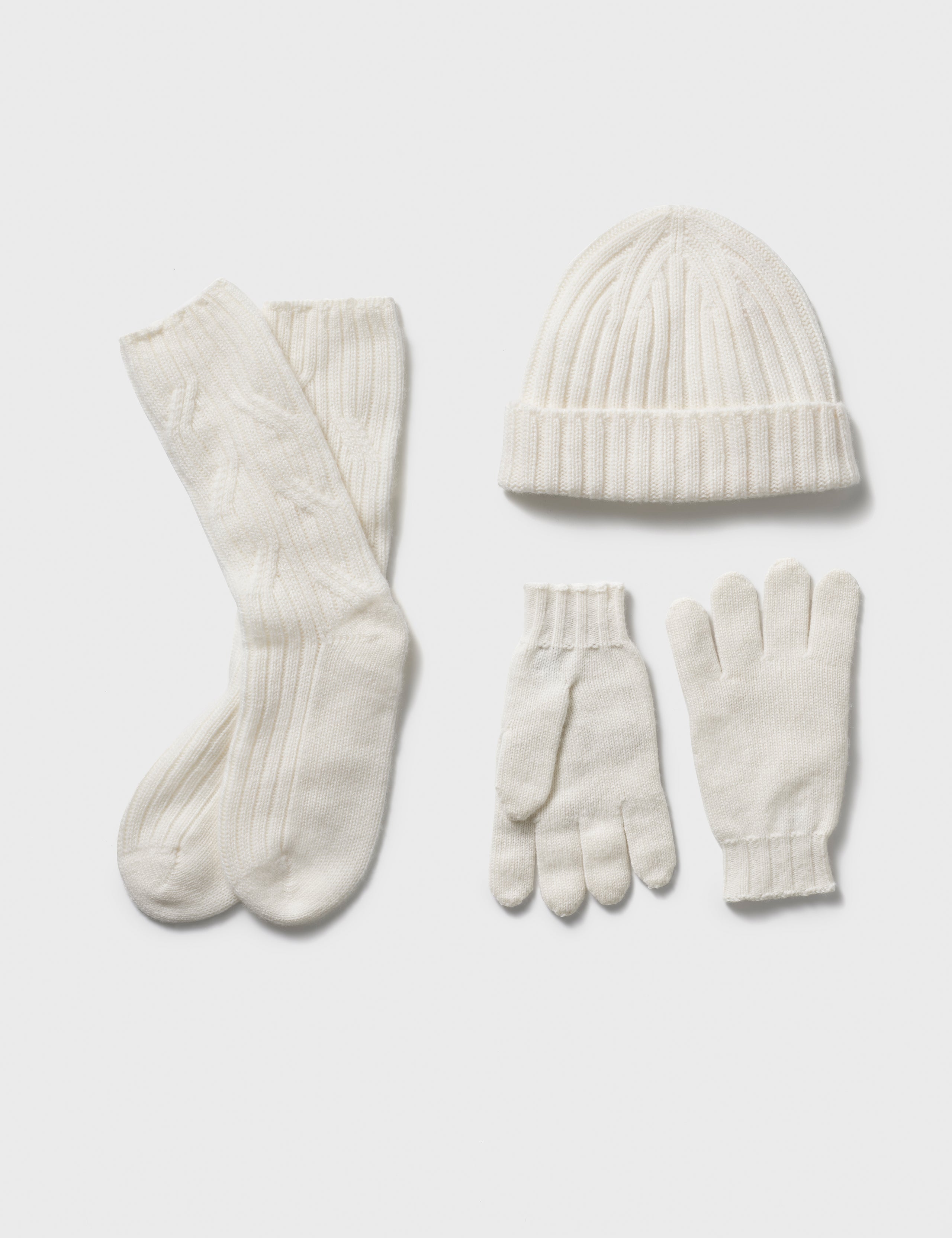 White cashmere hat, socks, and gloves from AETHER Apparel