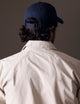 back view of man wearing blue AETHER Mountain Hat