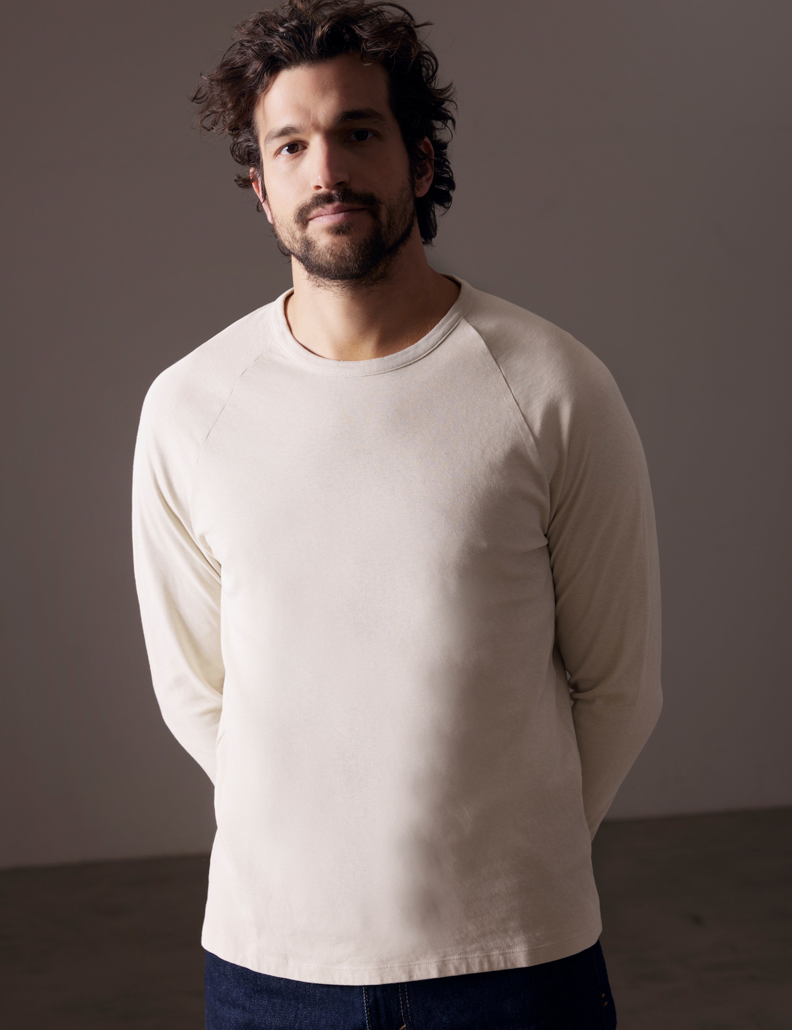 man wearing beige long-sleeve shirt from AETHER Apparel