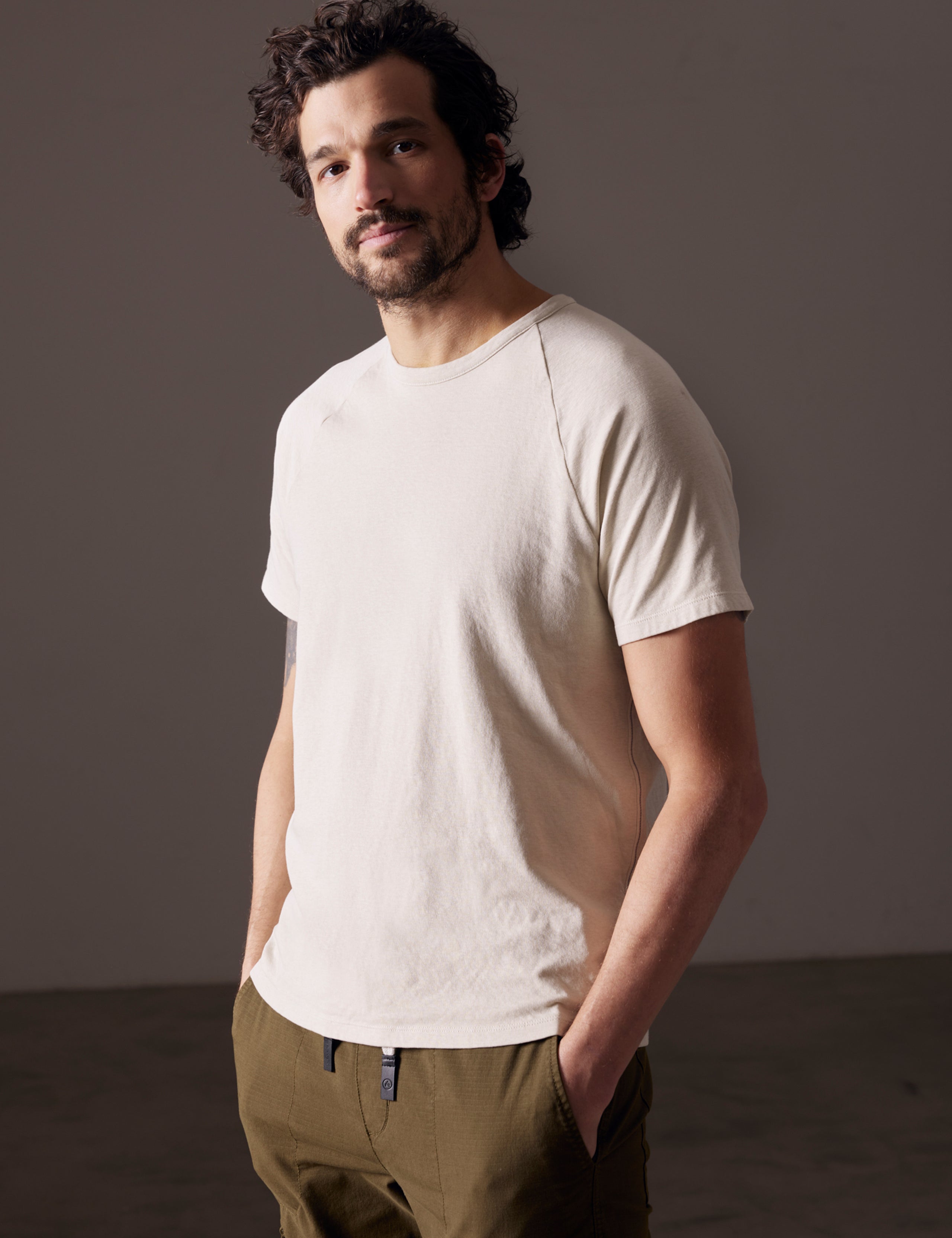 man wearing beige tee from AETHER Apparel