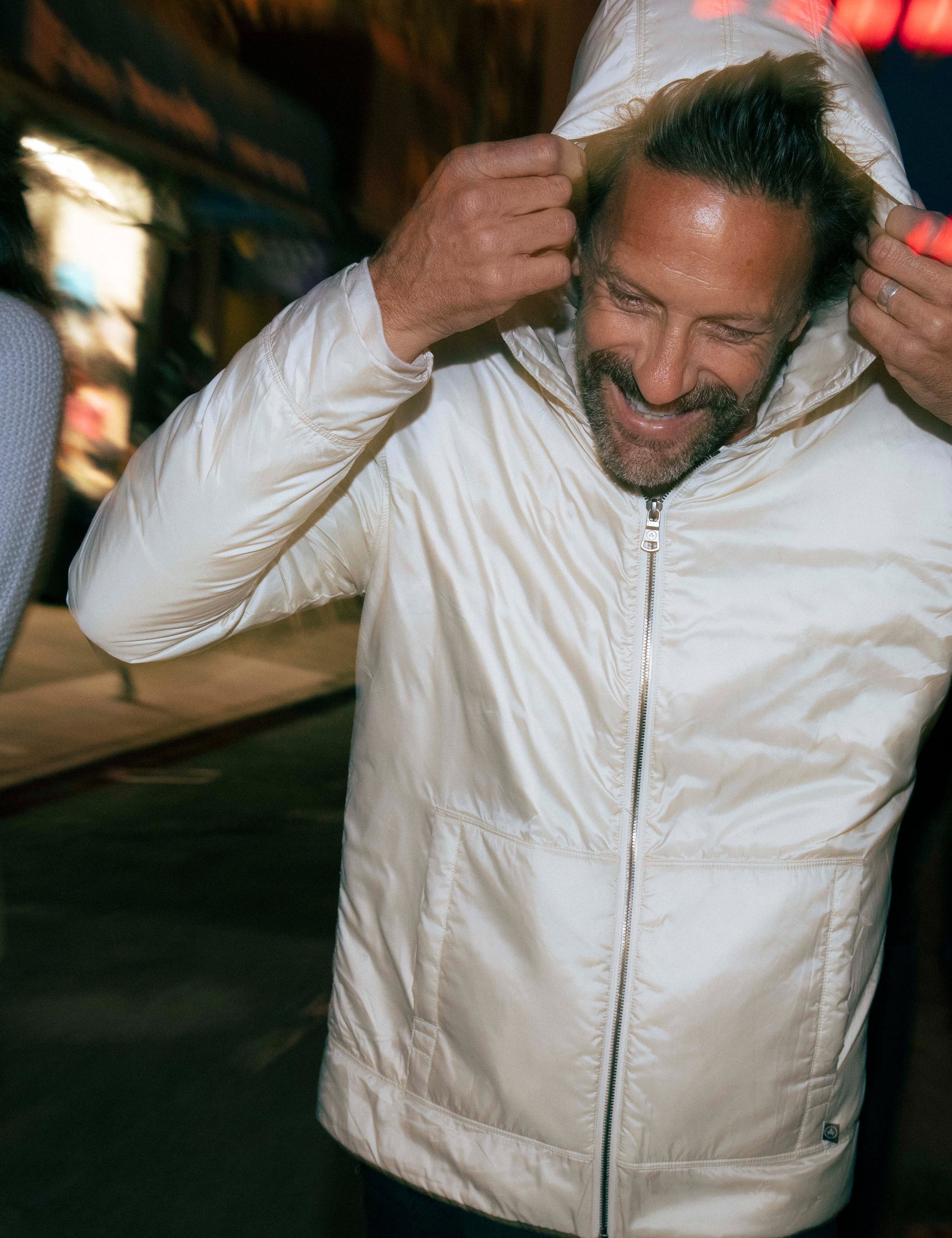 Man wearing white insulated hoodie from AETHER Apparel