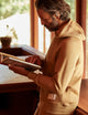 man wearing a brown hoodie