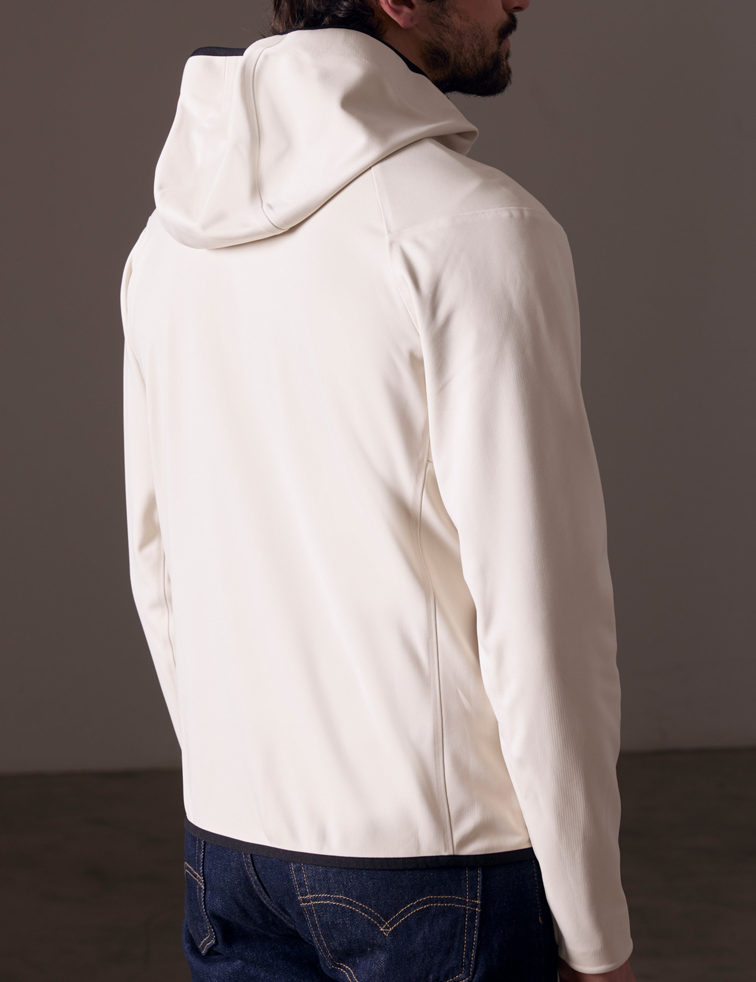 back view of man wearing beige fleece full-zip jacket