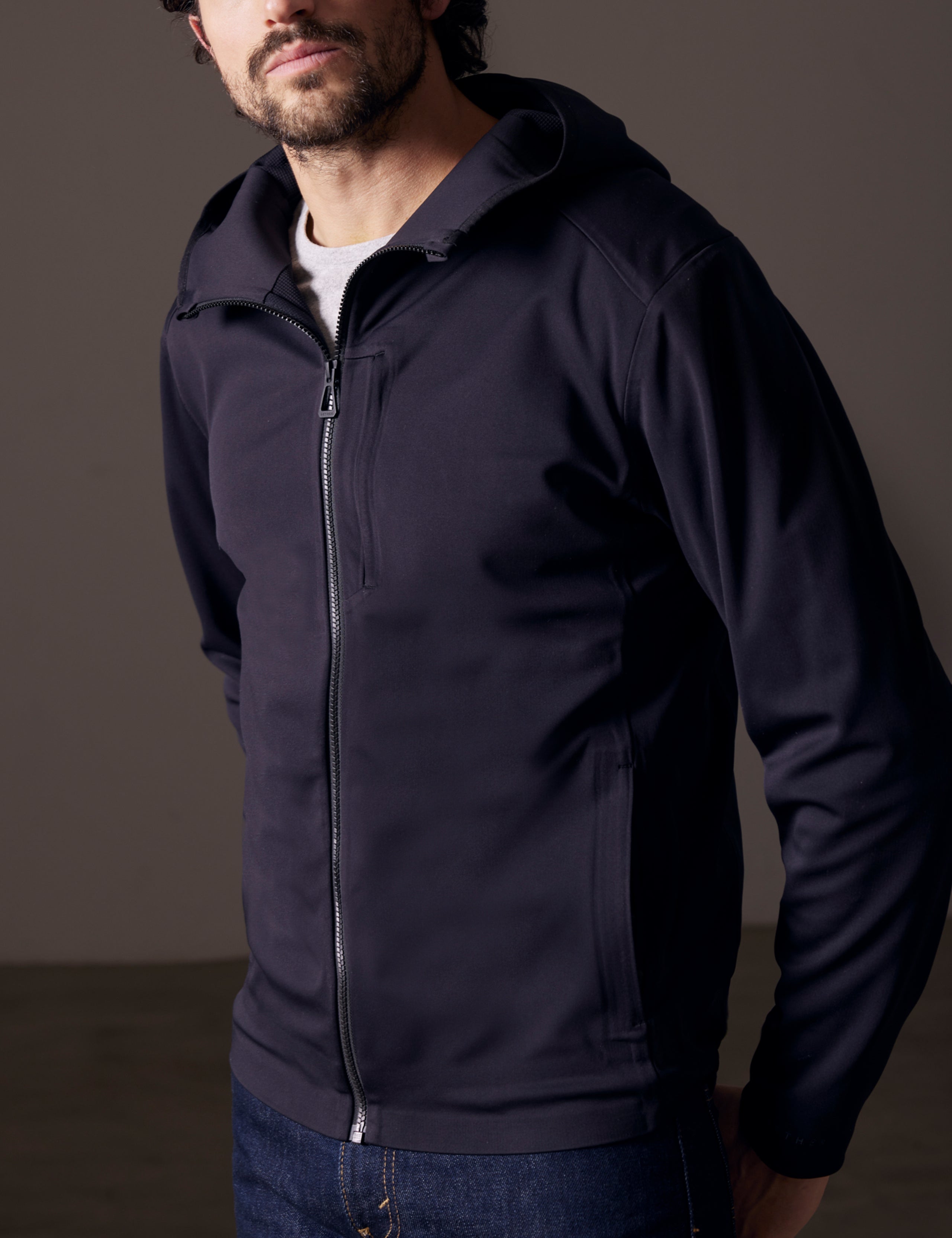 man wearing black fleece full-zip jacket from AETHER Apparel