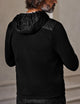 man wearing insulated black hoodie