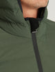 man wearing green insulated jacket