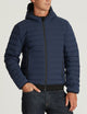 man wearing dark blue insulated jacket