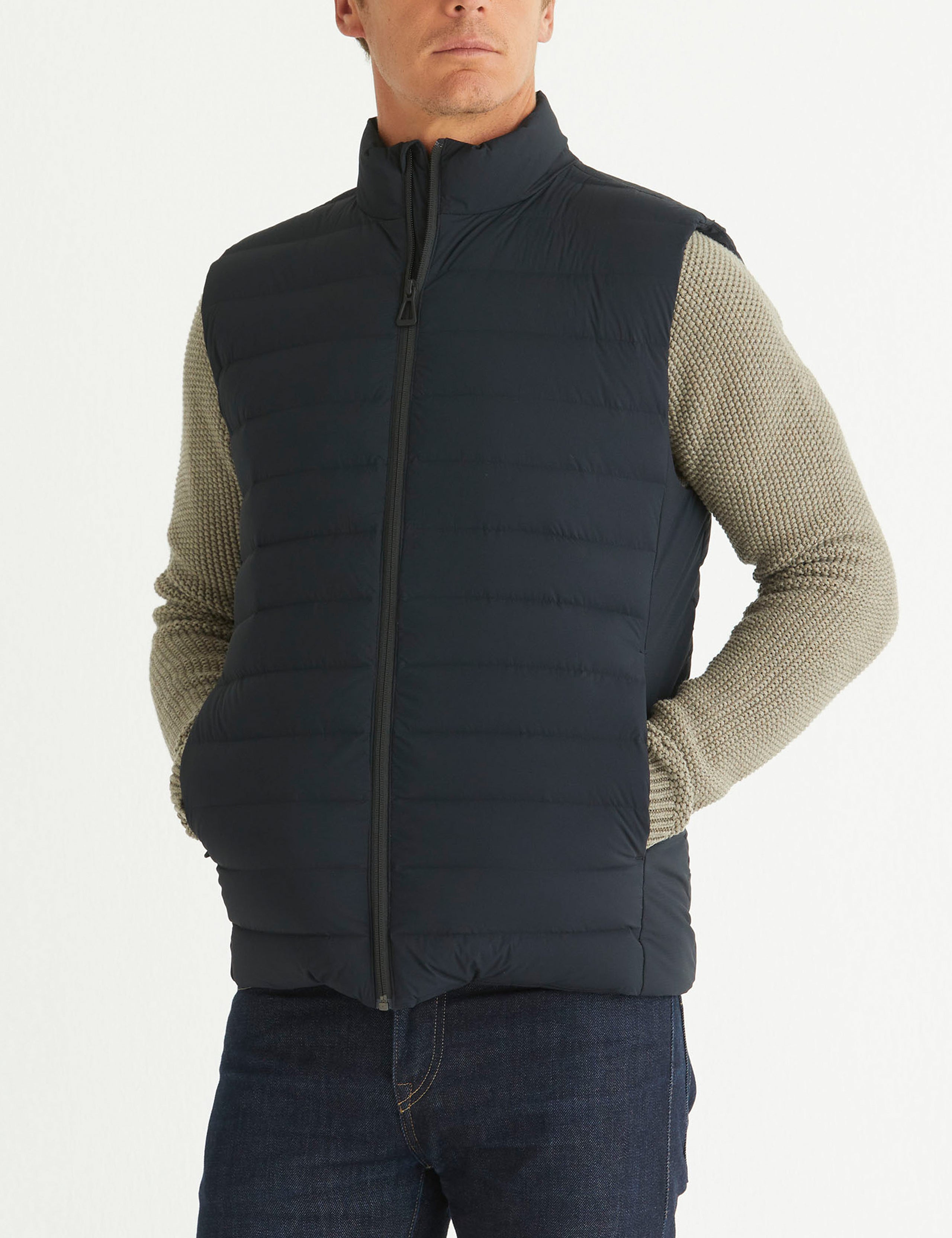 man wearing black insulated vest