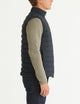 man wearing black insulated vest